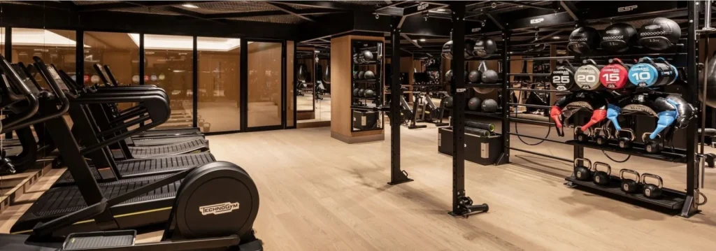 The Londoner hotel gym image showing premium fitness equipment, free weights and training space